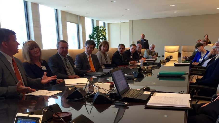 Auto leaders around conference table