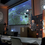 President Joe DiPietro at podium giving address