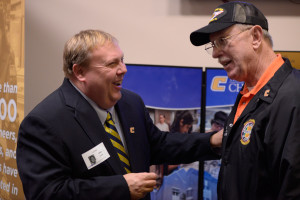 UT Chattanooga’s Chuck Cantrell talks with a veteran at UT Day on the Hill.