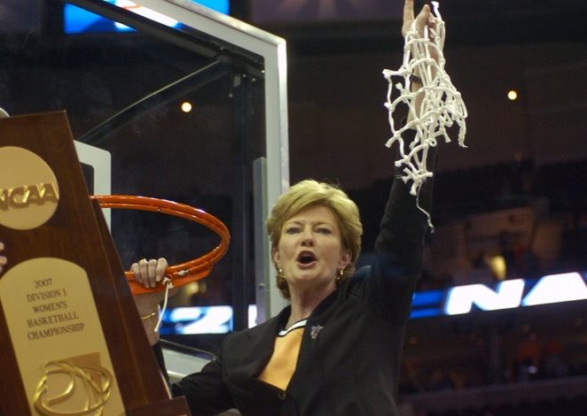 Summitt cutting down the basketball net in 2007 with the NCAA National Champion trophy in the foreground