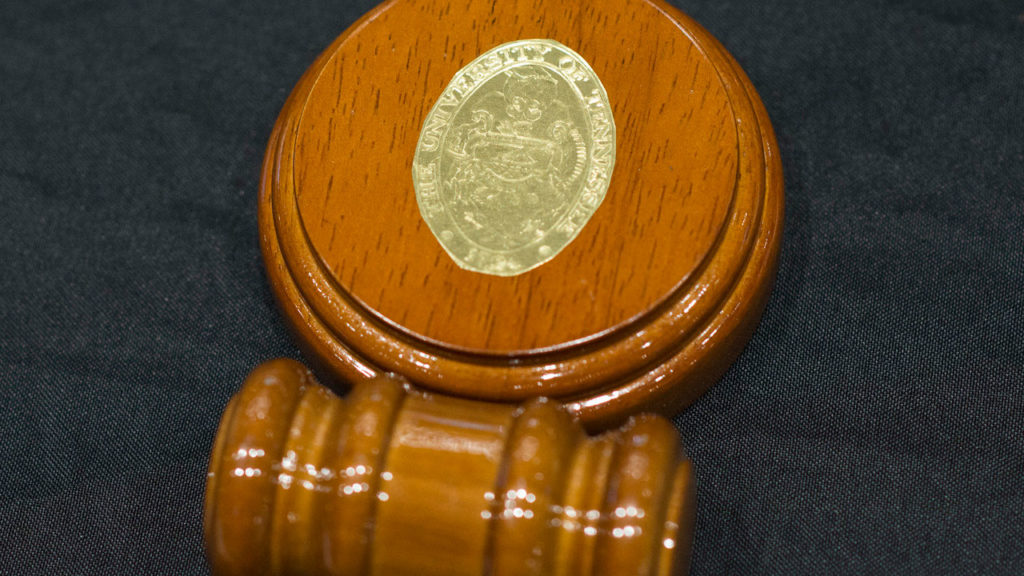 The ceremonial wood and brass gavel used for Board of Trustees meetings