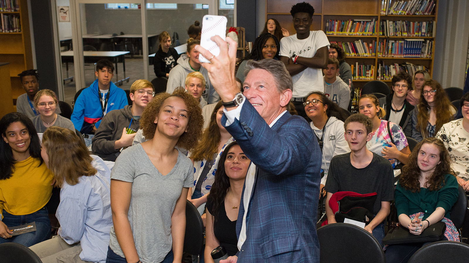 Randy Boyd takes a selfie with a group of teens at a Tennessee high school on the UT Promise tour