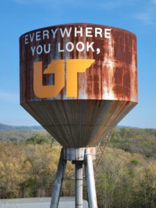 A rusted water tower with fresh paint declaring Everywhere You Look, UT