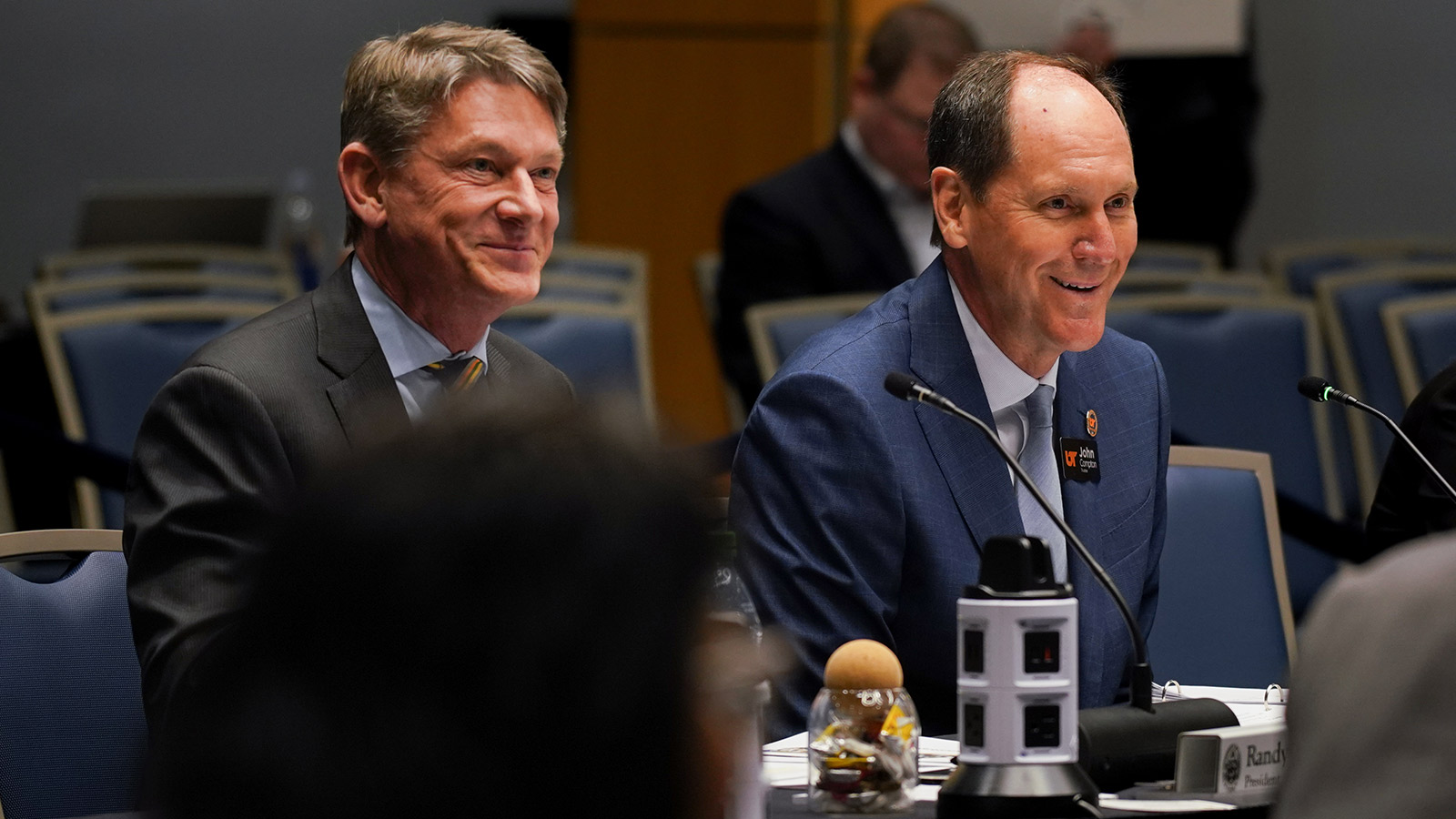 Randy Boyd sitting next to John Compton at the Board of Trustees Feb. 2023 Winter Meeting