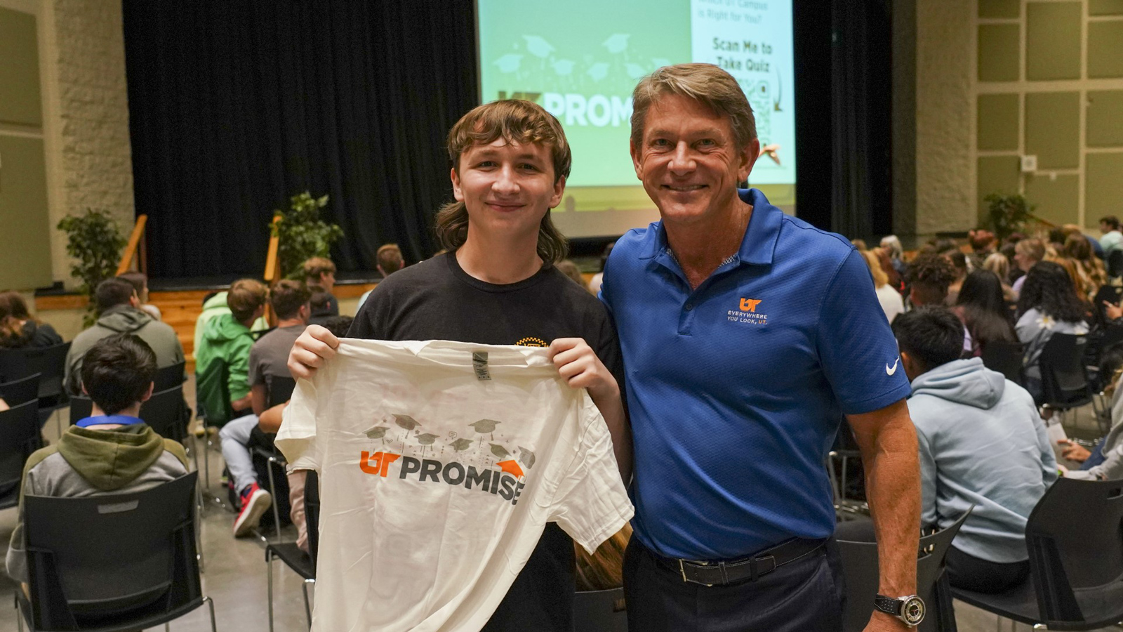 UT System President Randy Boyd posed next to a high school student at a UT Promise tour stop.