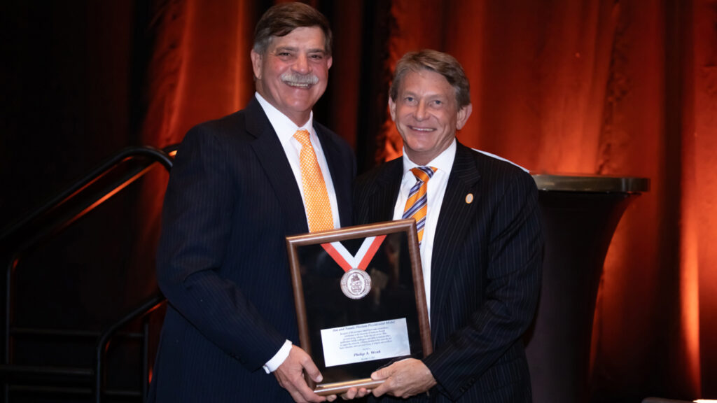 UT System President Randy Body (left) with Philip Wenk (right) at the Presidents Council Awards