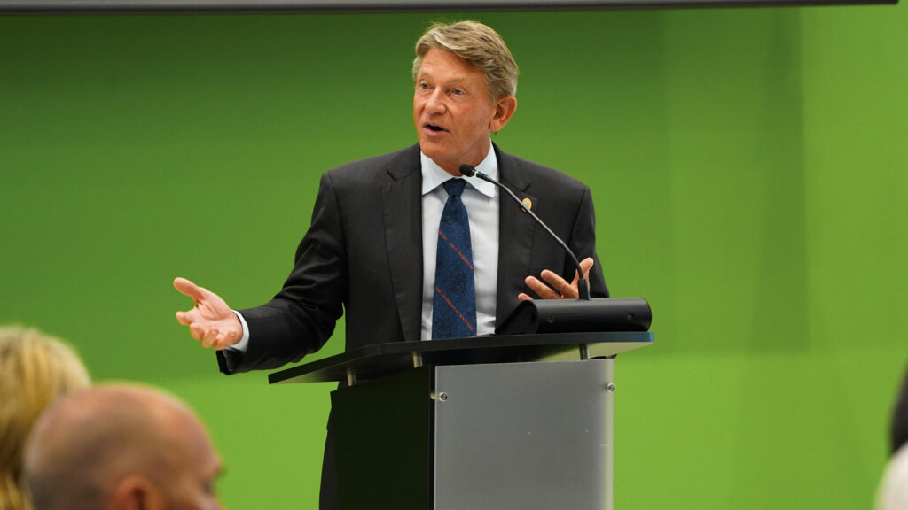 UT System President Randy Boyd speaking at a podium