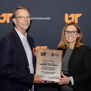 UT System vp of communications and marketing (right) standing next to Tennessee Press Association winner from The Standard Banner (left).